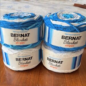 4 cakes of Bernat Blanket Stripes Yarn in Pool Party